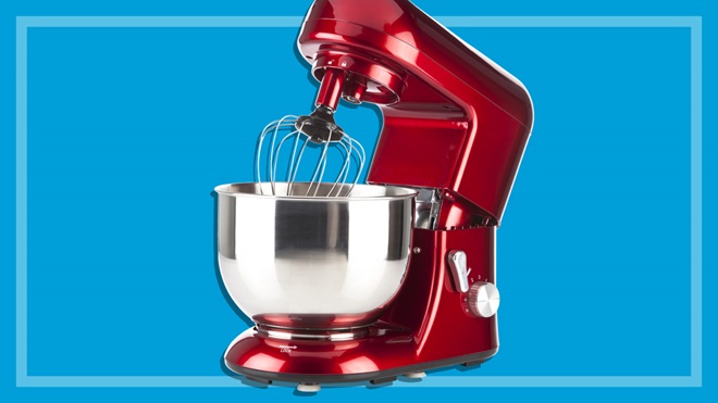 red benchtop stand mixer on a blue background